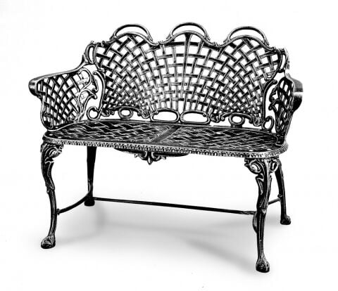 Three Coins Cast’s aluminum basket weave settee